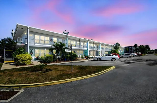 a view of a house with a swimming pool and a yard