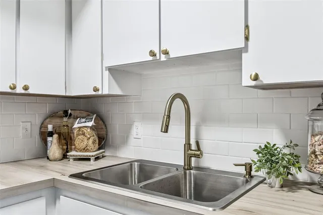 a view of a room with furniture and wooden floor