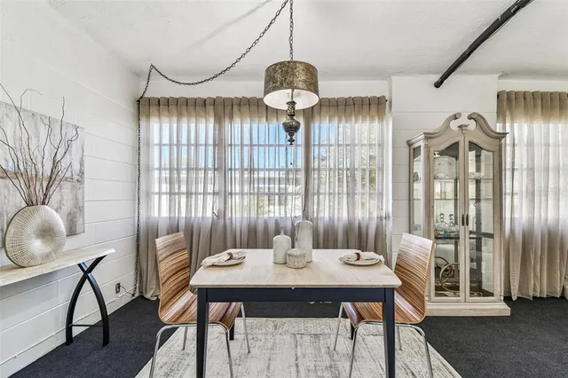 a bedroom with a bed and a mirror