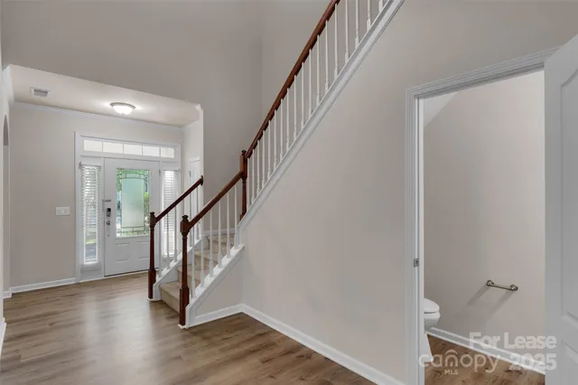 a view of entryway with wooden floor