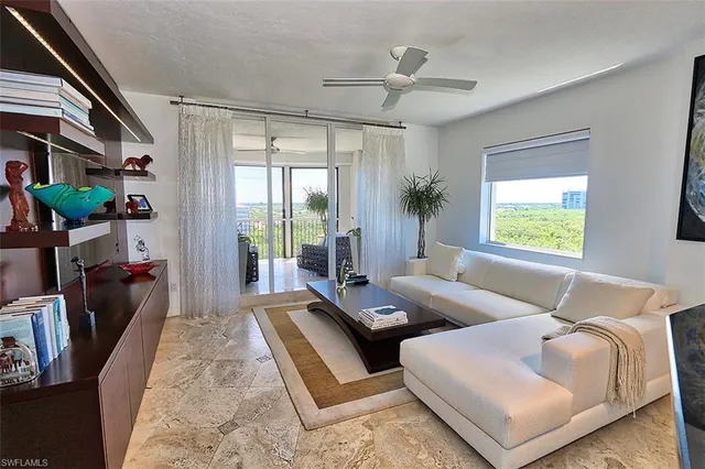 a living room with furniture and a window