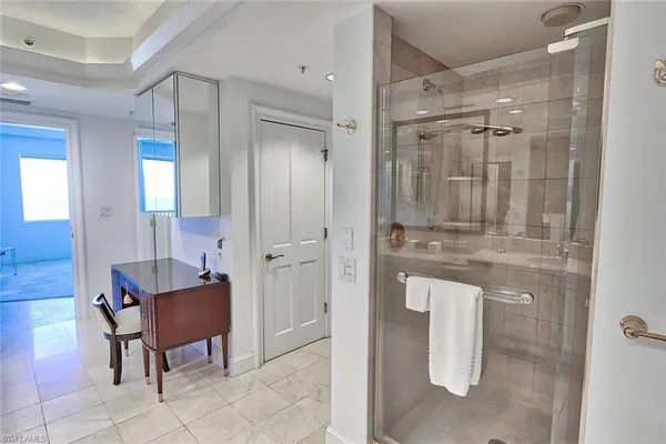 a bathroom with a mirror and a shower
