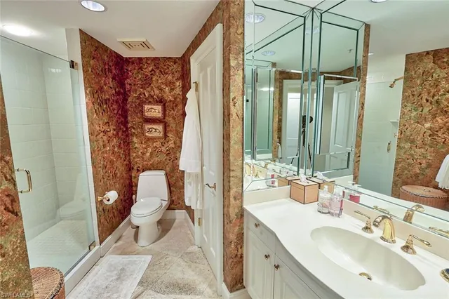 a spacious bathroom with a double vanity sink and a mirror