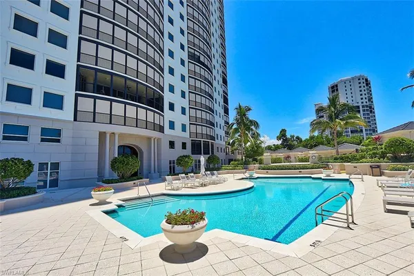 a view of a swimming pool with a patio