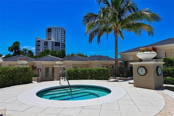 a house with swimming pool in front of it