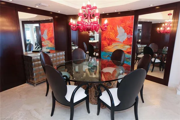 a view of a dining room with furniture window and chandelier