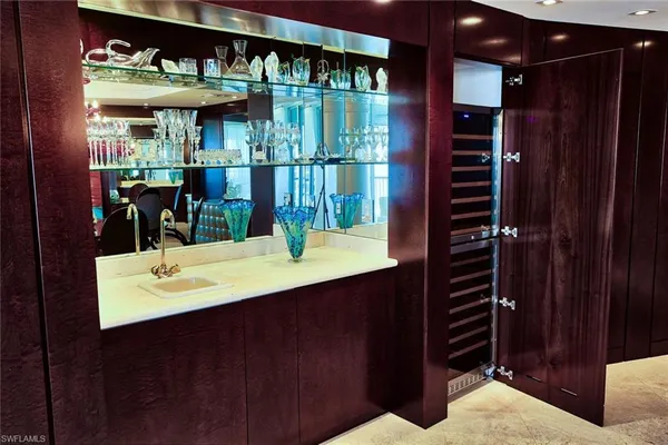 a bathroom with a sink a mirror and shower