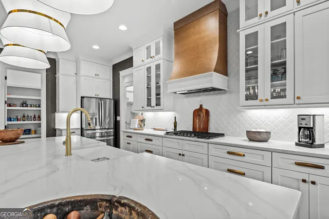 a kitchen with counter top space and appliances
