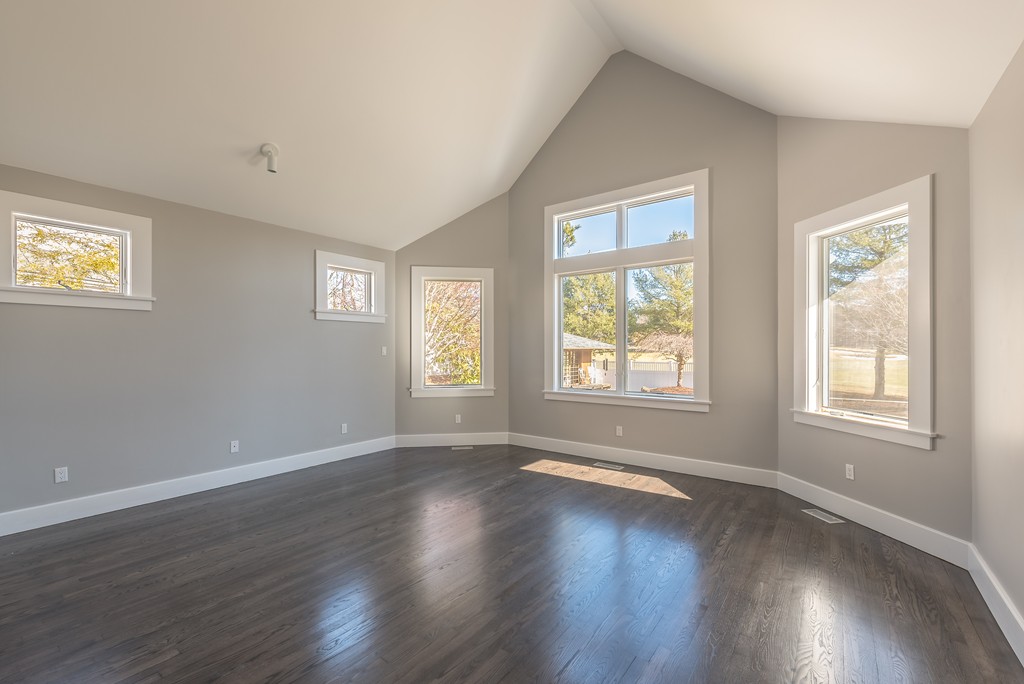 145 Willowbend Drive Mashpee, MA 02649 - Photo 13 of 16 a view of an empty room with wooden floor and a window