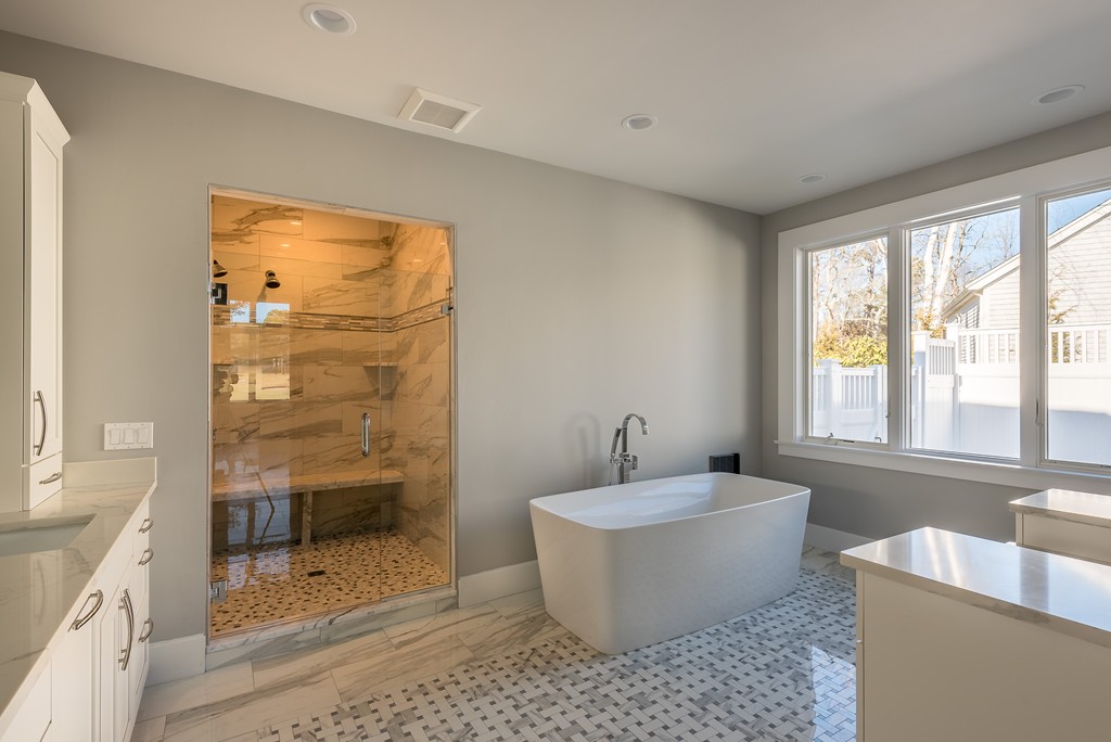 145 Willowbend Drive Mashpee, MA 02649 - Photo 15 of 16 a bathroom with a bathtub and window