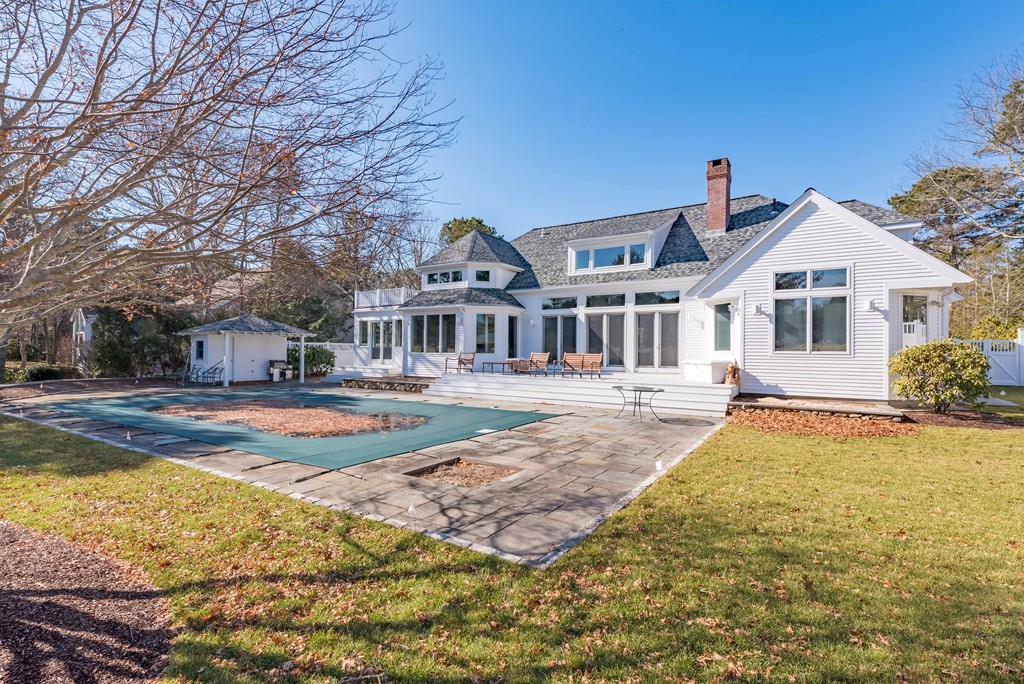 145 Willowbend Drive Mashpee, MA 02649 - Photo 2 of 16 a front view of a house with swimming pool
