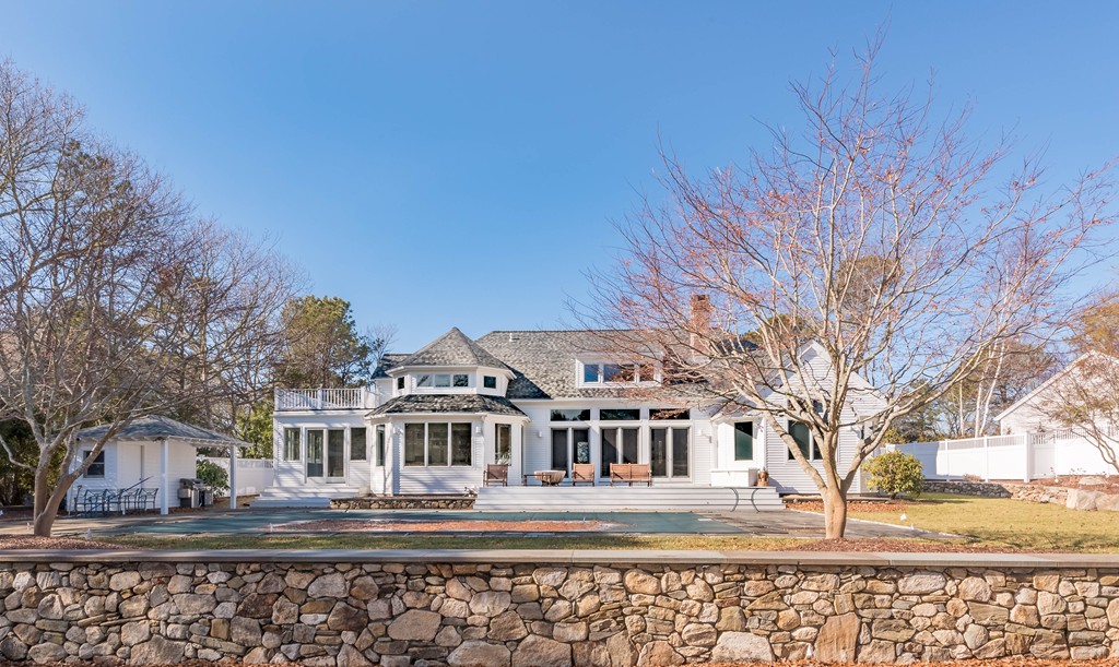 145 Willowbend Drive Mashpee, MA 02649 - Photo 3 of 16 a front view of a house with a yard