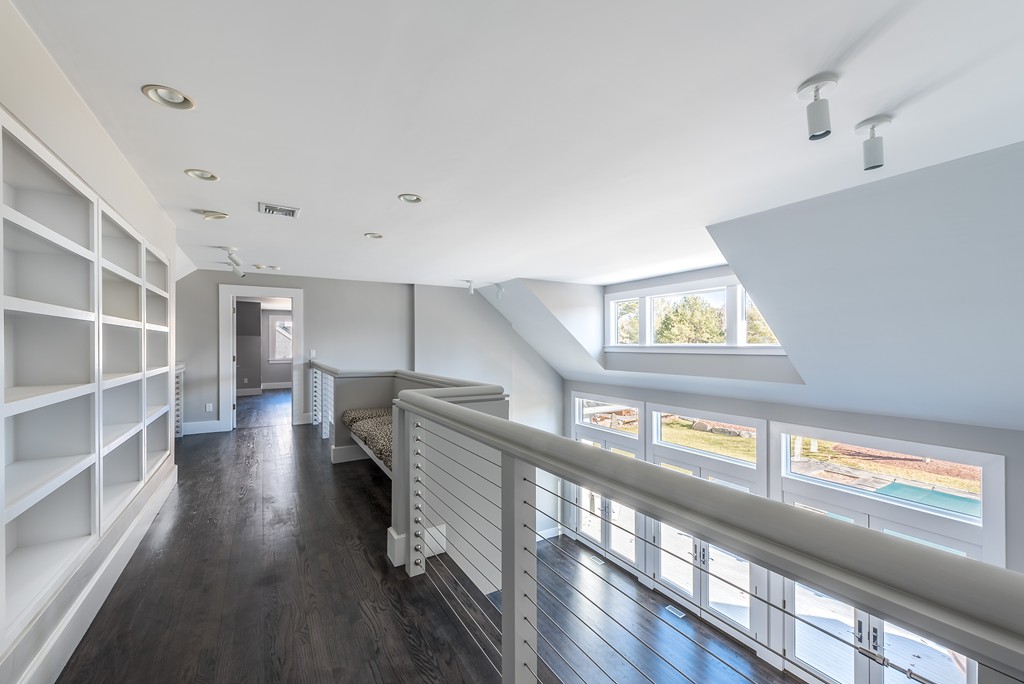 145 Willowbend Drive Mashpee, MA 02649 - Photo 4 of 16 a view of a hallway with wooden floor and staircase