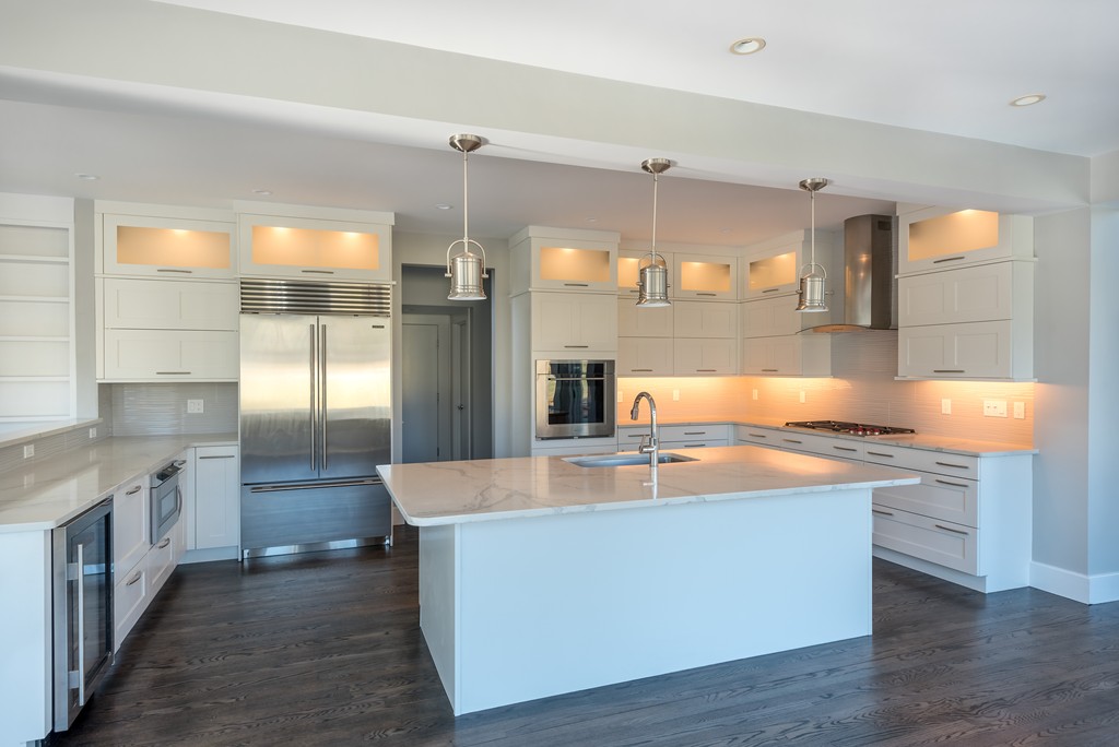 145 Willowbend Drive Mashpee, MA 02649 - Photo 7 of 16 a large kitchen with stainless steel appliances a large counter top a stove a refrigerator and a sink