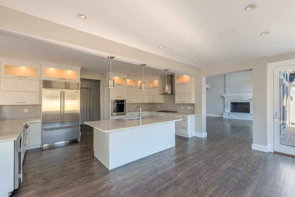 145 Willowbend Drive Mashpee, MA 02649 - Photo 8 of 16 a large kitchen with a large counter top a sink stainless steel appliances and cabinets