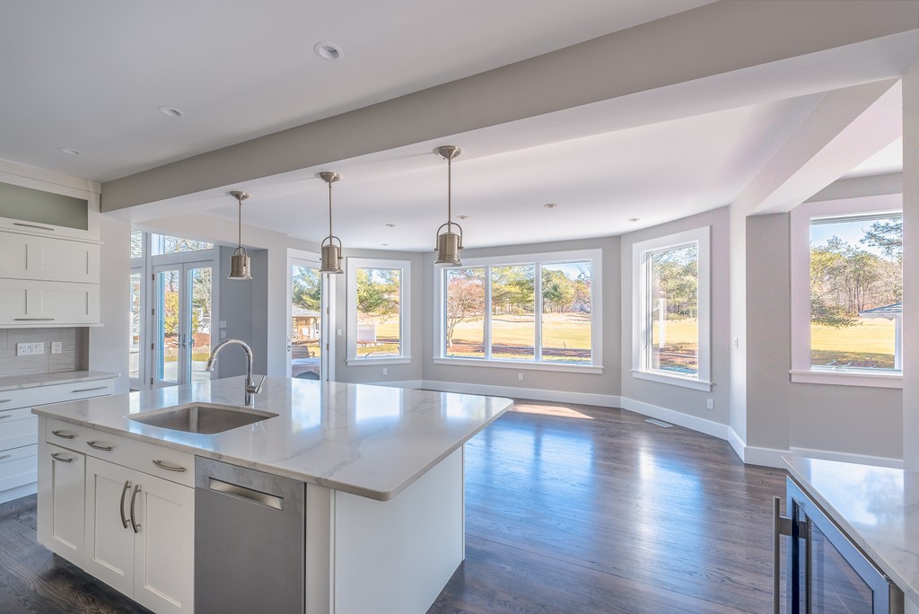 145 Willowbend Drive Mashpee, MA 02649 - Photo 10 of 16 a kitchen with stainless steel appliances granite countertop a sink a stove and a wooden floors