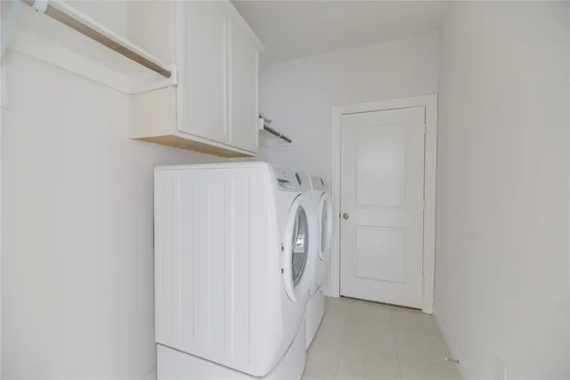 a view of walk in closet with white walls