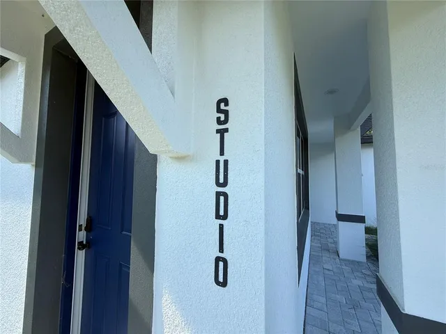 a view of staircase with white walls