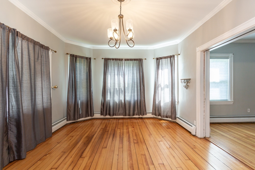 724 High Street Fall River, MA 02720 - Photo 14 of 39 wooden floor in an empty room with a window