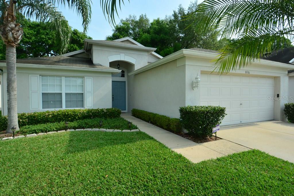 816 Ridge Haven Drive Brandon, FL 33511 - Photo 1 of 1 a house that has a lot of plants and palm trees