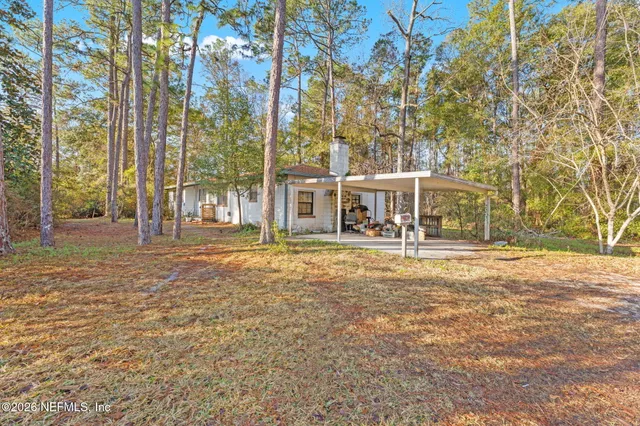 front view of a building with a yard