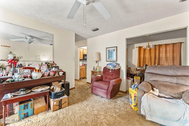a view of a livingroom with furniture and a couch