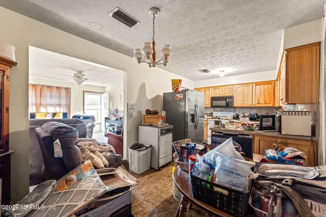 a view of a livingroom with furniture and a window