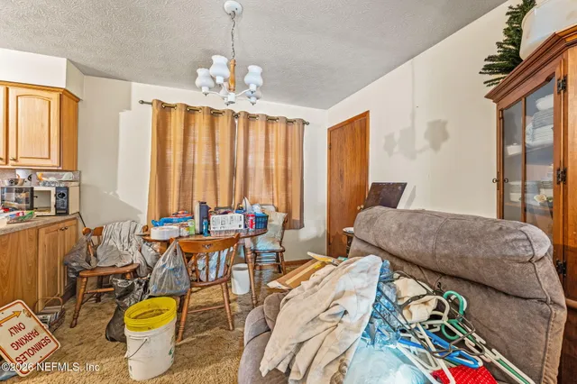 a bedroom with furniture and a chandelier