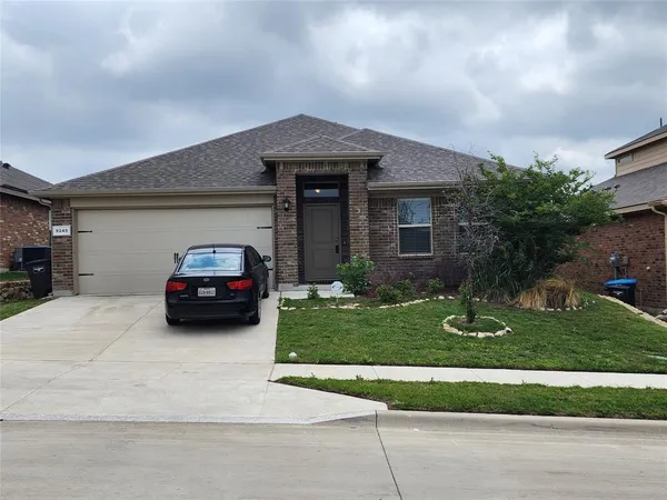a car parked in front of a house