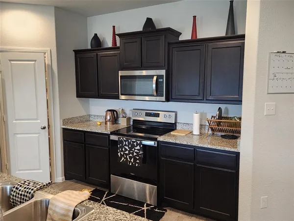 a view of a big yard with wooden fence