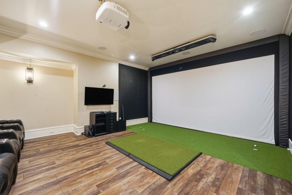 841 Camden Park Court Atlanta, GA 30342 - Photo 110 of 120 a living room with a flat screen tv and a wooden floor