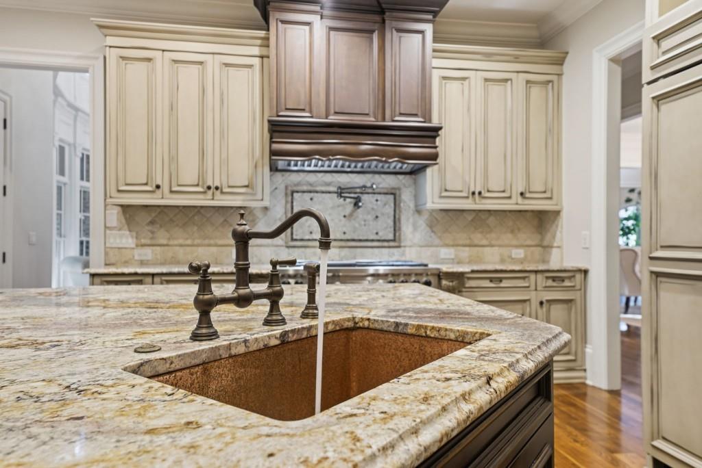 841 Camden Park Court Atlanta, GA 30342 - Photo 12 of 120 a kitchen with granite countertop a sink stove and cabinets