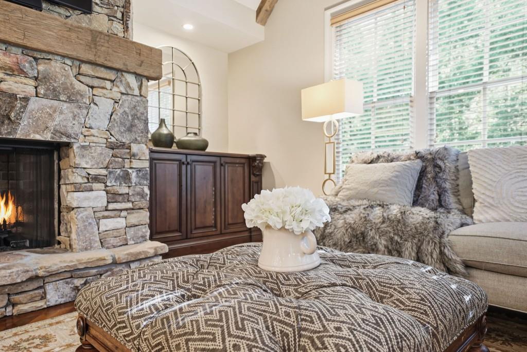 841 Camden Park Court Atlanta, GA 30342 - Photo 15 of 120 a bedroom with a bed and a fireplace