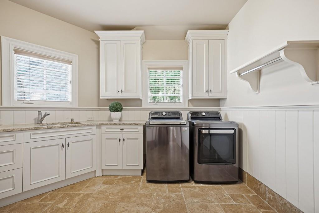 841 Camden Park Court Atlanta, GA 30342 - Photo 20 of 120 a kitchen with stainless steel appliances granite countertop a sink stove and refrigerator