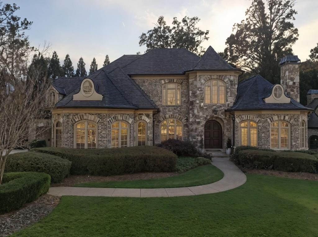 841 Camden Park Court Atlanta, GA 30342 - Photo 2 of 120 a front view of a house with a yard