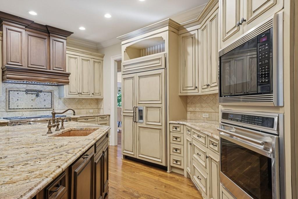 841 Camden Park Court Atlanta, GA 30342 - Photo 22 of 120 a kitchen with stainless steel appliances granite countertop a refrigerator sink and stove