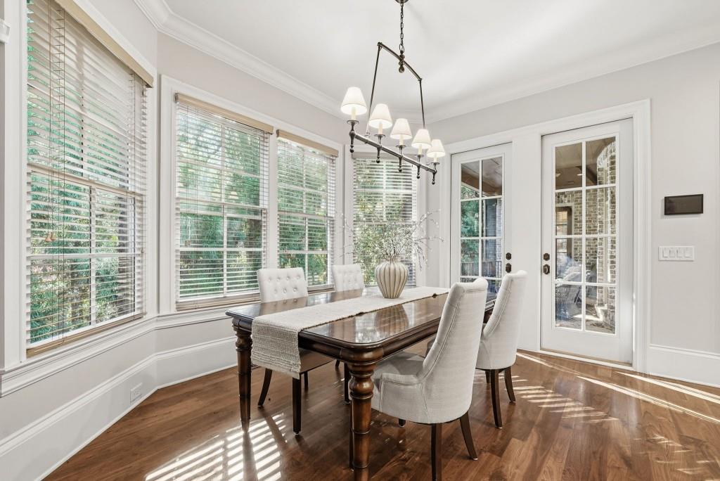841 Camden Park Court Atlanta, GA 30342 - Photo 25 of 120 a view of a dining room with furniture large windows and wooden floor