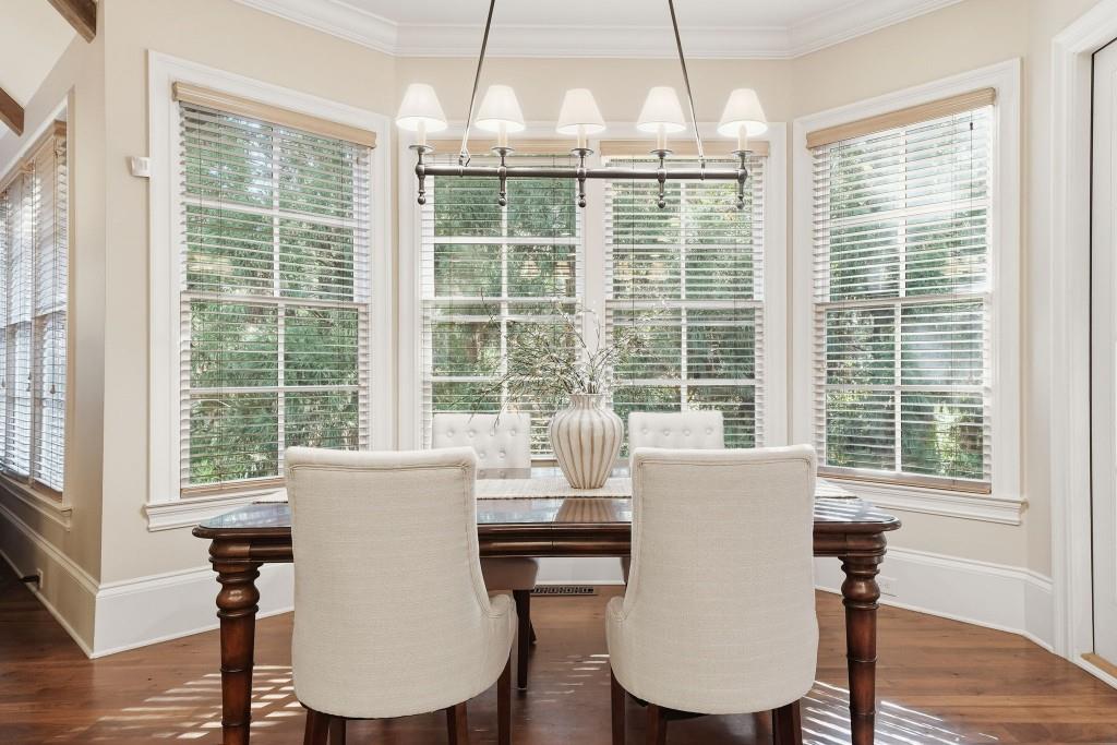 841 Camden Park Court Atlanta, GA 30342 - Photo 27 of 120 a view of a dining room with furniture window and wooden floor