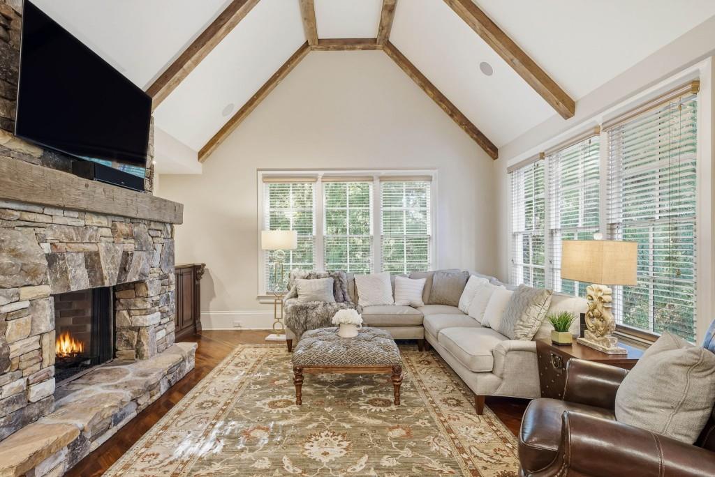 841 Camden Park Court Atlanta, GA 30342 - Photo 29 of 120 a living room with furniture and a fireplace