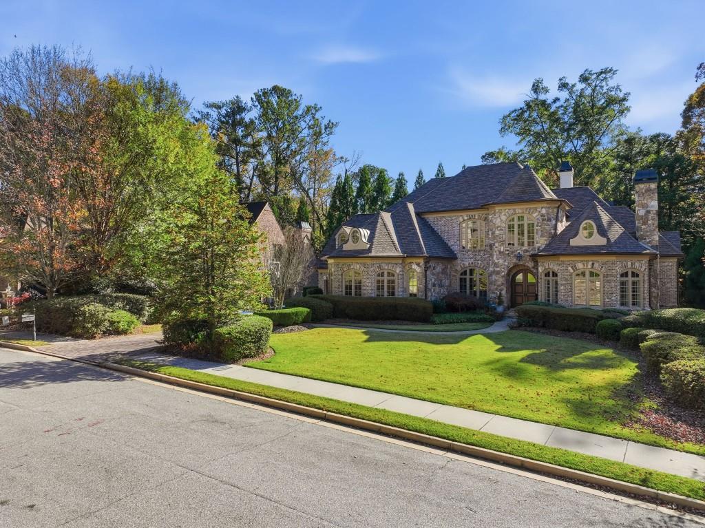 841 Camden Park Court Atlanta, GA 30342 - Photo 4 of 120 a view of house with garden space and sitting area