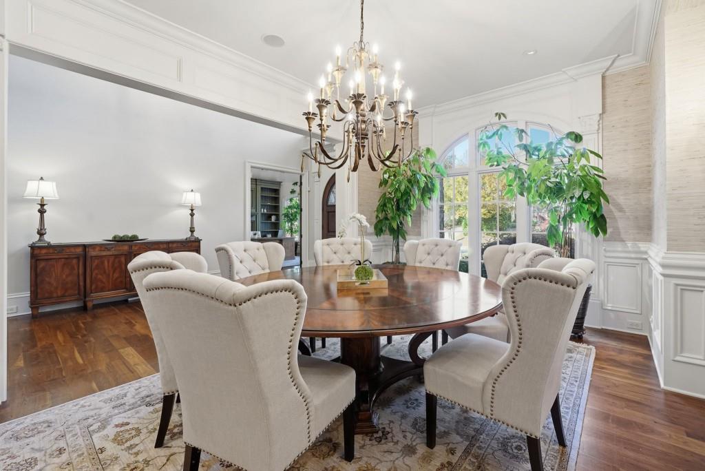 841 Camden Park Court Atlanta, GA 30342 - Photo 41 of 120 a dining room with furniture potted plants and wooden floor