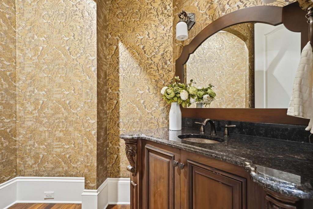 841 Camden Park Court Atlanta, GA 30342 - Photo 44 of 120 a bathroom with a granite countertop sink and a mirror