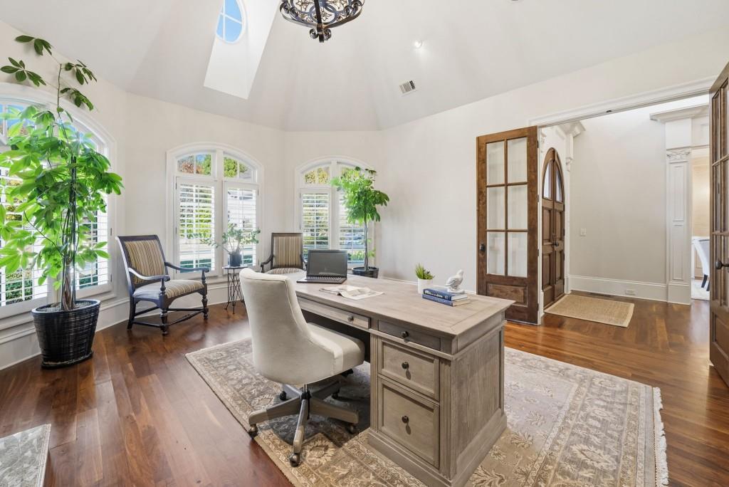 841 Camden Park Court Atlanta, GA 30342 - Photo 52 of 120 a view of a dining room with furniture and wooden floor