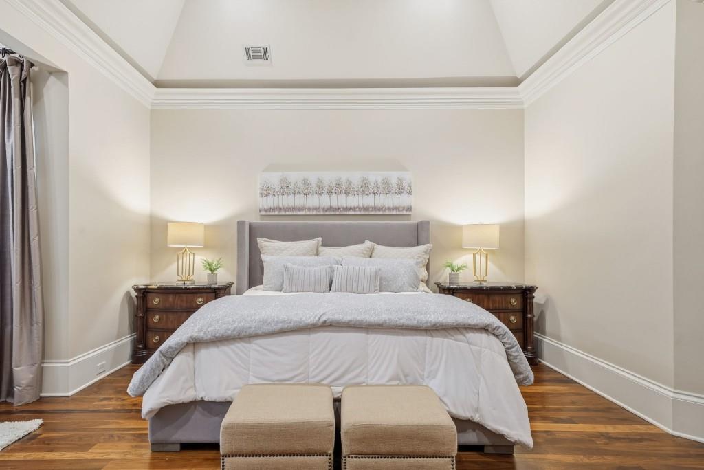 841 Camden Park Court Atlanta, GA 30342 - Photo 54 of 120 a bedroom with a bed and a night stand