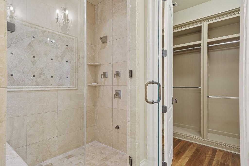 841 Camden Park Court Atlanta, GA 30342 - Photo 60 of 120 a bathroom with a glass shower door