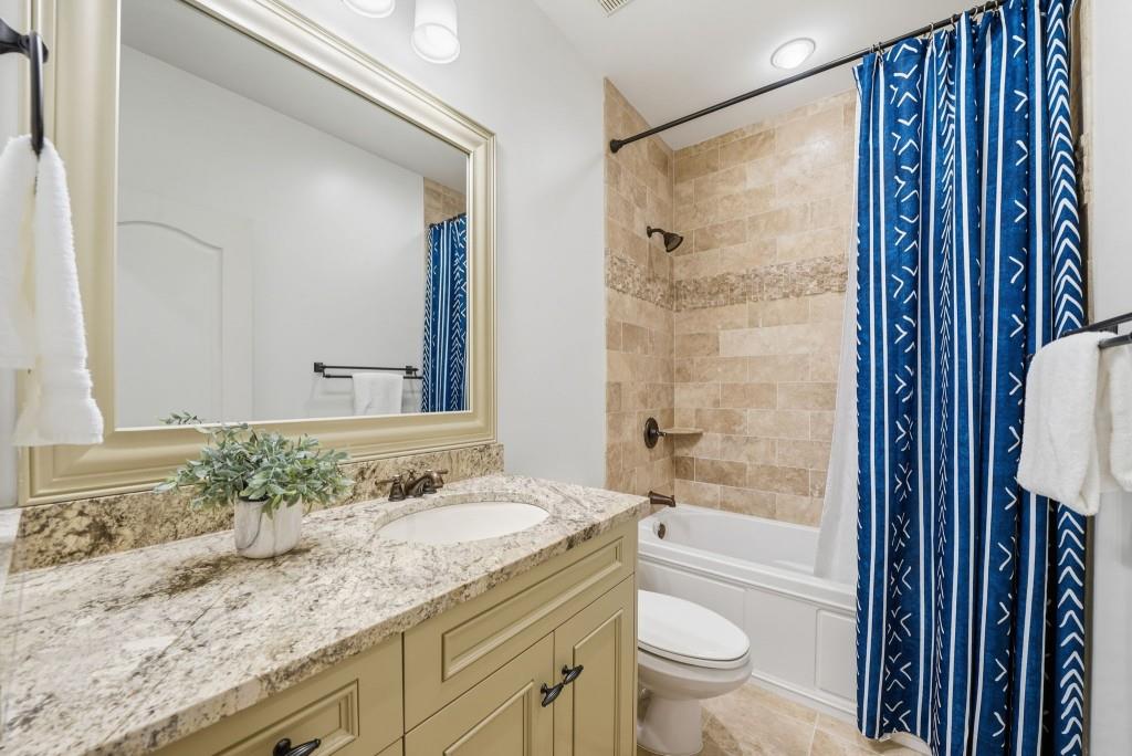 841 Camden Park Court Atlanta, GA 30342 - Photo 77 of 120 a bathroom with a granite countertop sink toilet and shower