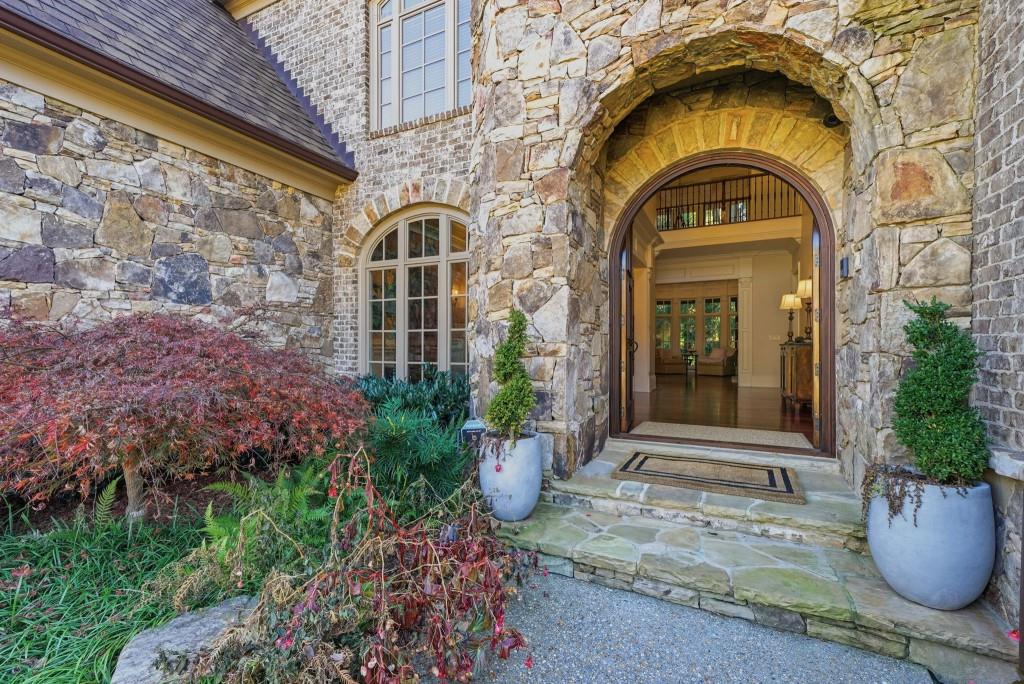 841 Camden Park Court Atlanta, GA 30342 - Photo 83 of 120 a front view of a house with outdoor seating