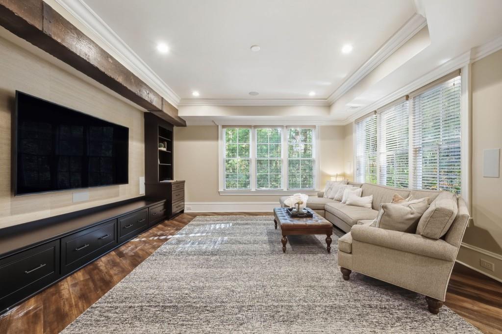 841 Camden Park Court Atlanta, GA 30342 - Photo 88 of 120 a living room with furniture tv and large window