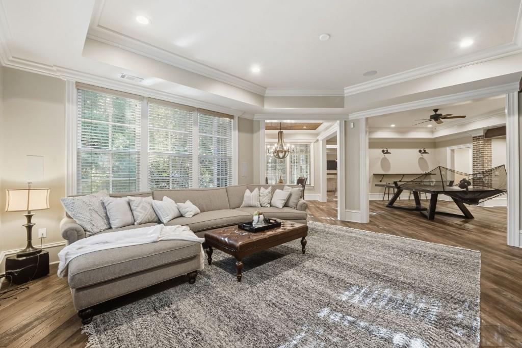 841 Camden Park Court Atlanta, GA 30342 - Photo 89 of 120 a living room with furniture and a large window