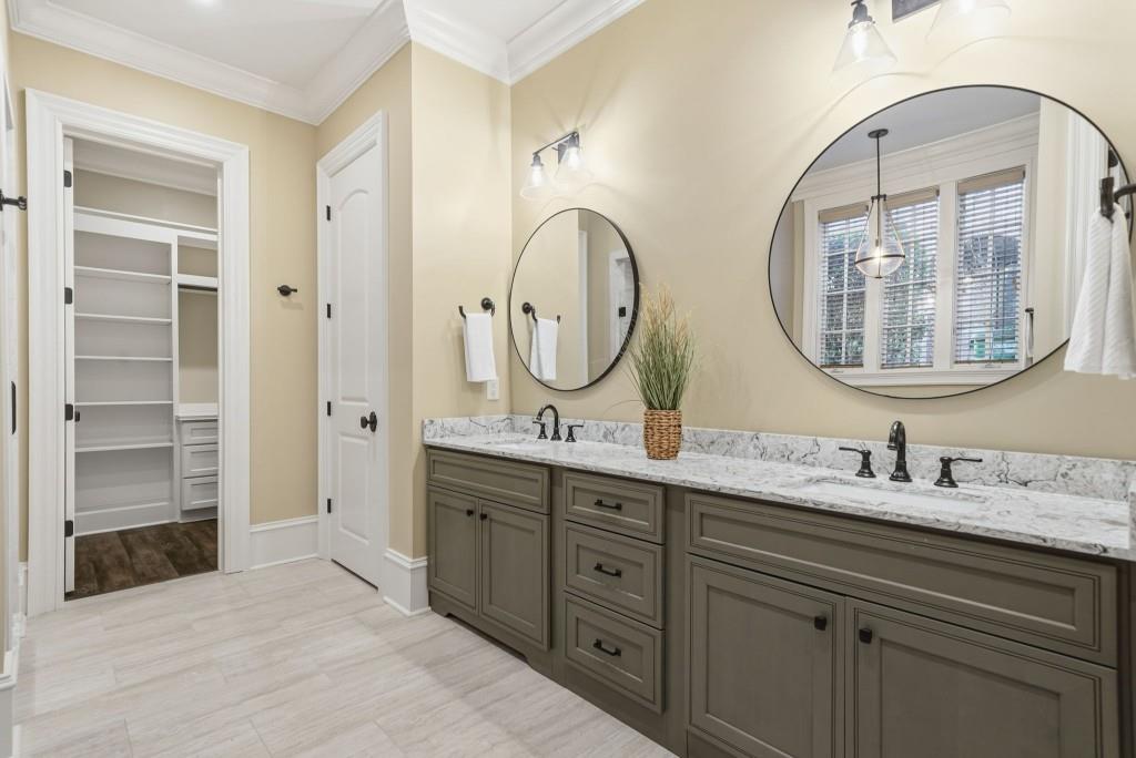 841 Camden Park Court Atlanta, GA 30342 - Photo 97 of 120 a bathroom with a double vanity sink double and a mirror